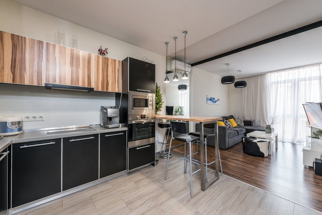 An image of a New York apartment’s kitchen and living room