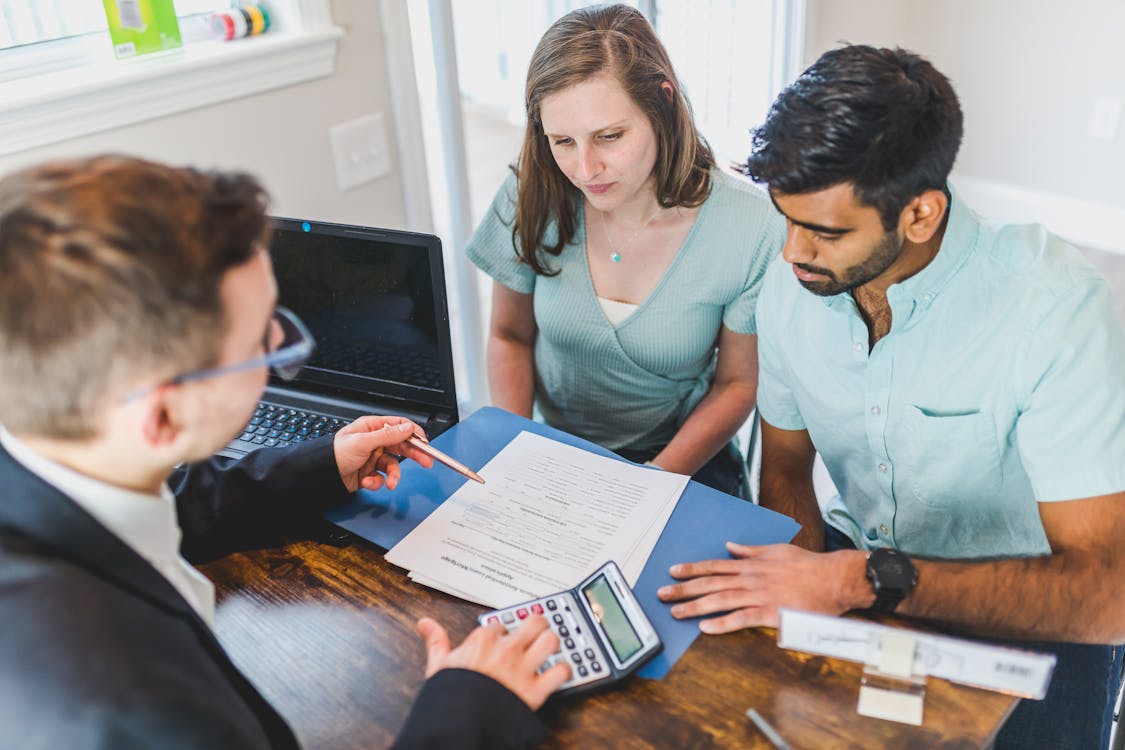 A real estate investor discussing with his clients