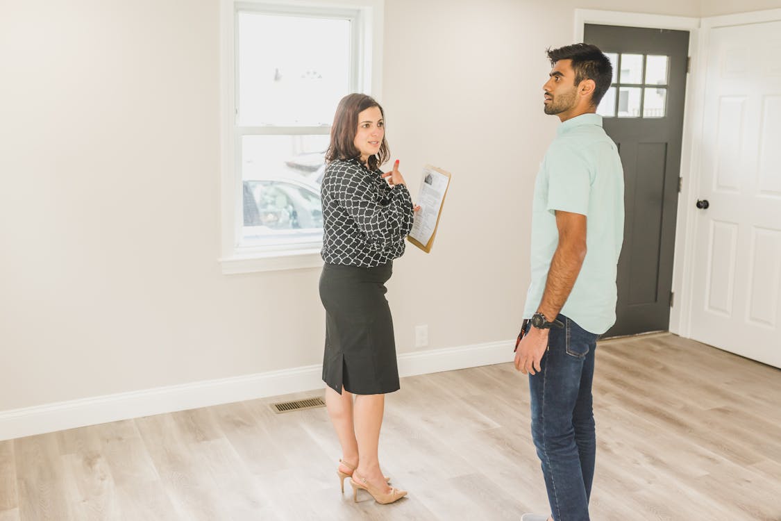 An image of a man and a woman checking a property