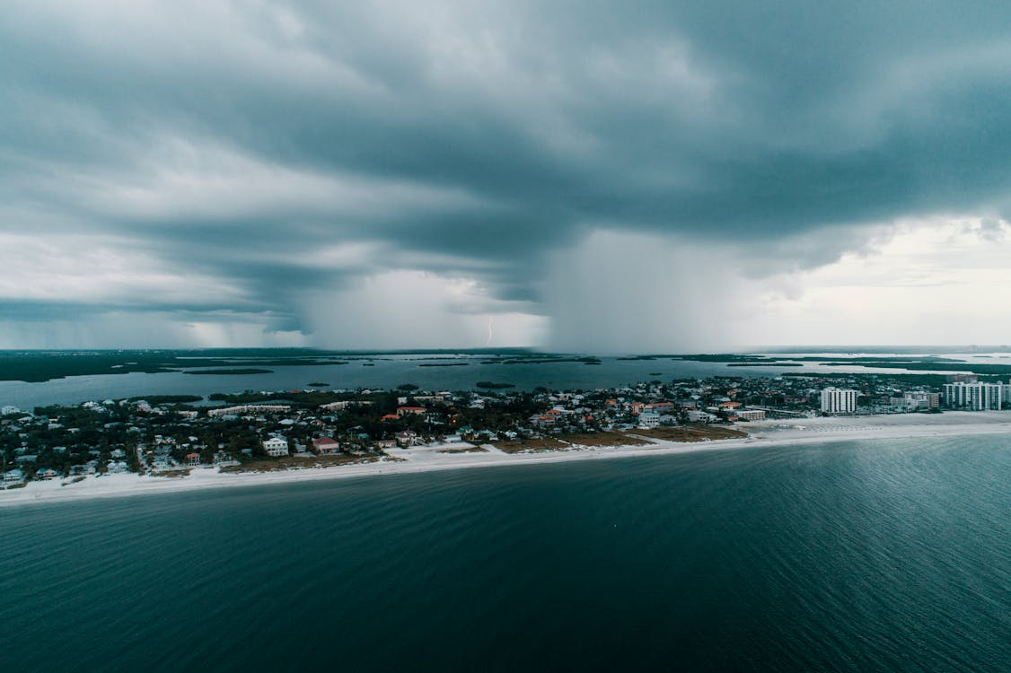 Aerial view of an island under dark clouds