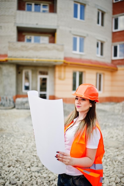  Construction professional reviewing plans on site.