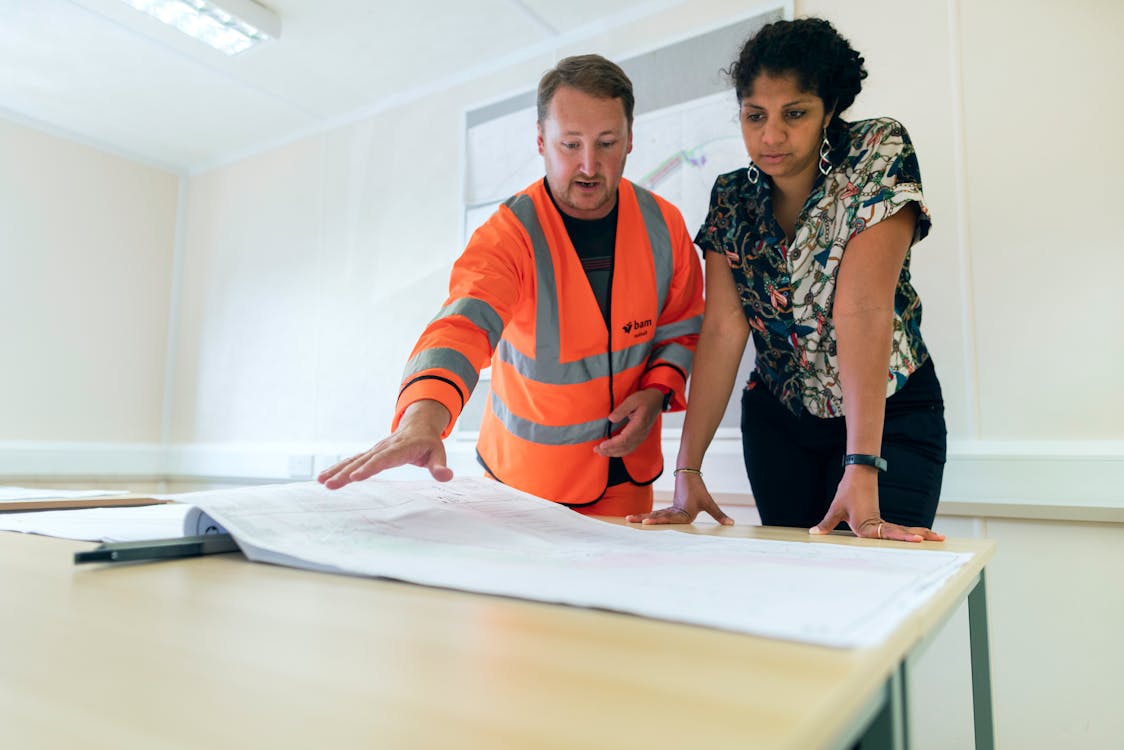 a contractor and real estate investor reviewing a project plan