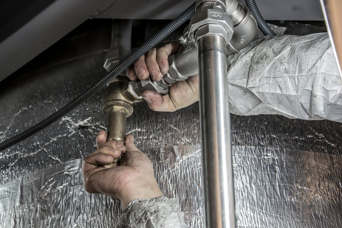 A Plumber Installing Pipe Fittings, a Job Requiring Cash Reserves