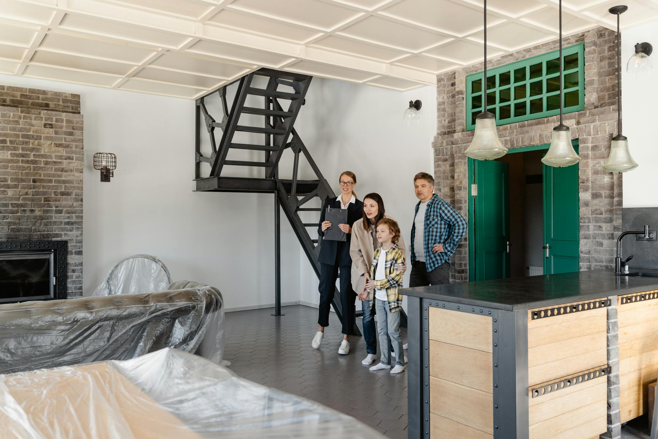 a realtor showing a single-family house to a family of three