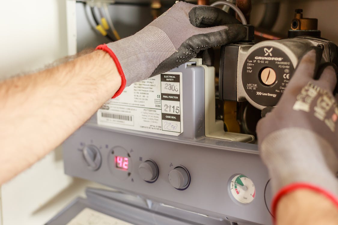 a plumber repairing a power source