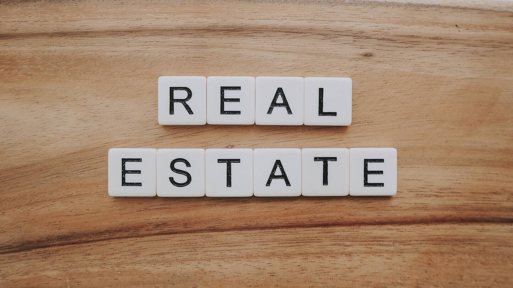 Real Estate written with Scrabble tiles.