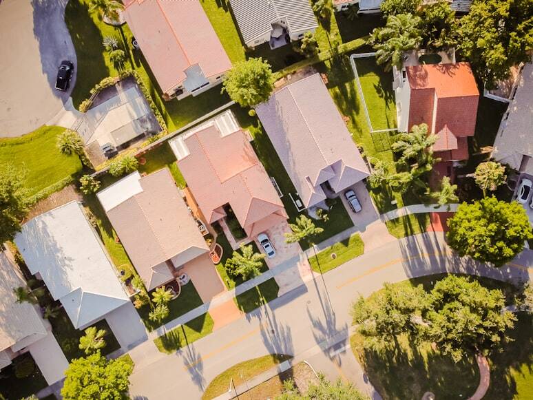 Aerial View of a Scenic Neighborhood with Road-Facing Homes