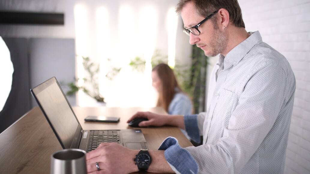 a real estate investor exploring loan types on their laptop